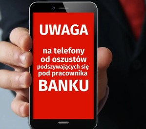 Telefon komórkowy trzymany w ręku.